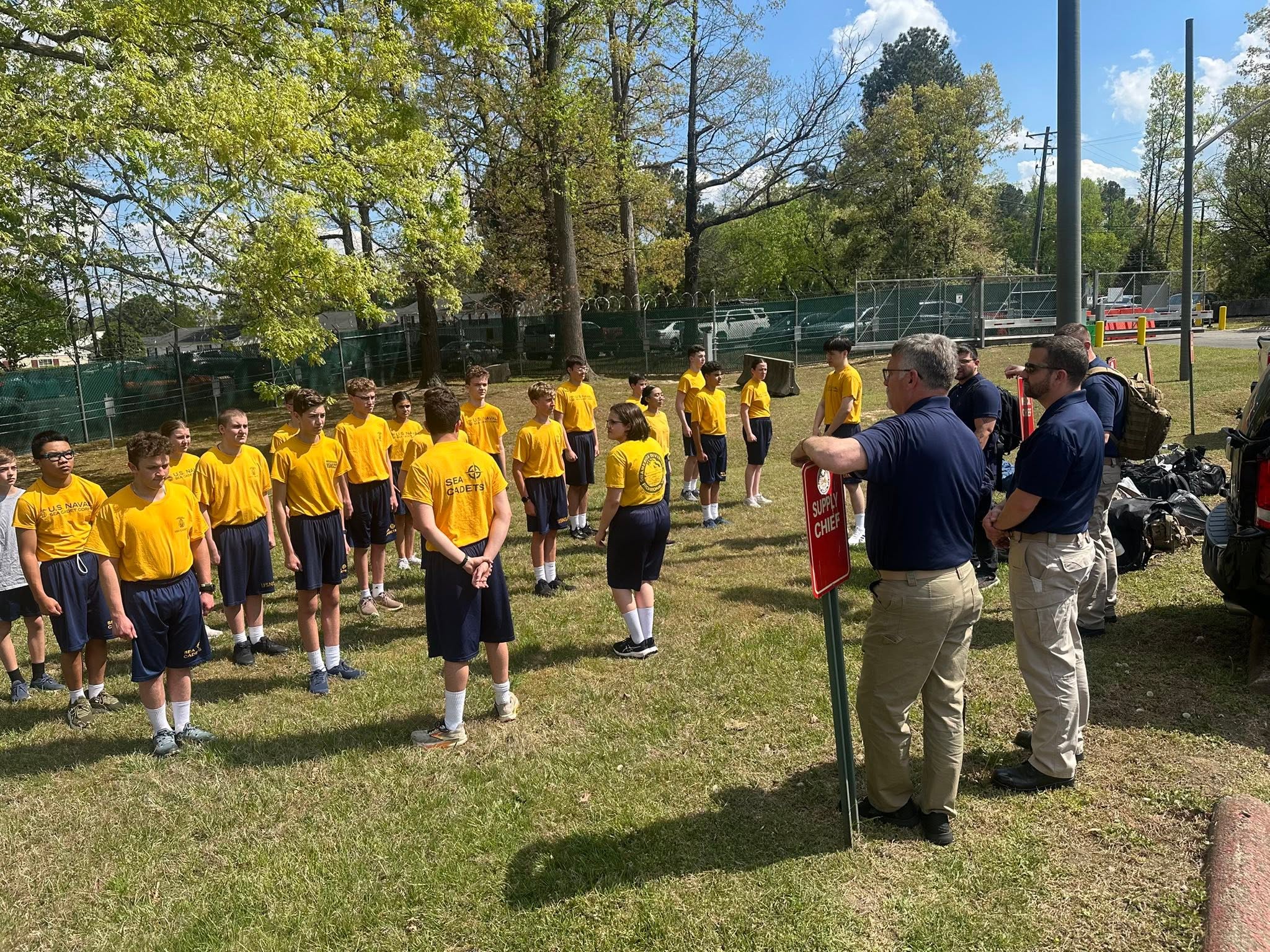 Large group of cadets in PT gear being briefed at the Richmond NOSC